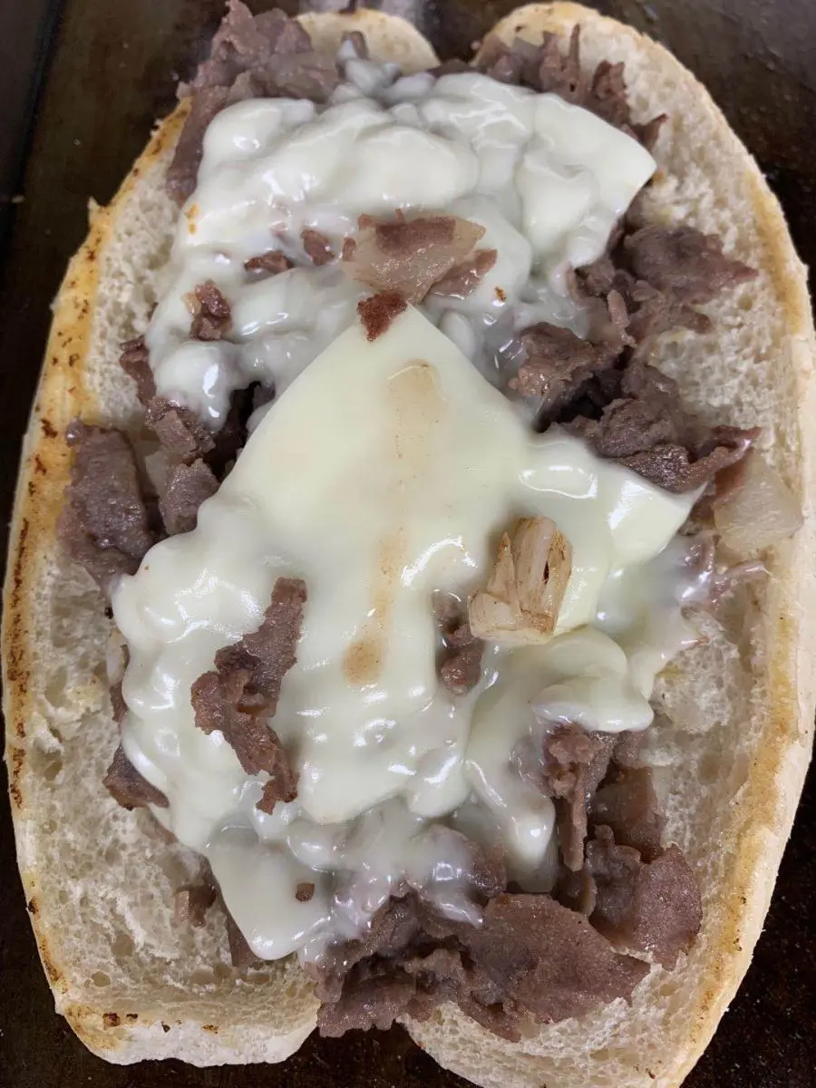 Philly cheesesteak sandwich with melted cheese and beef at Wings & Seafood, a Seafood Restaurant in Ridgewood